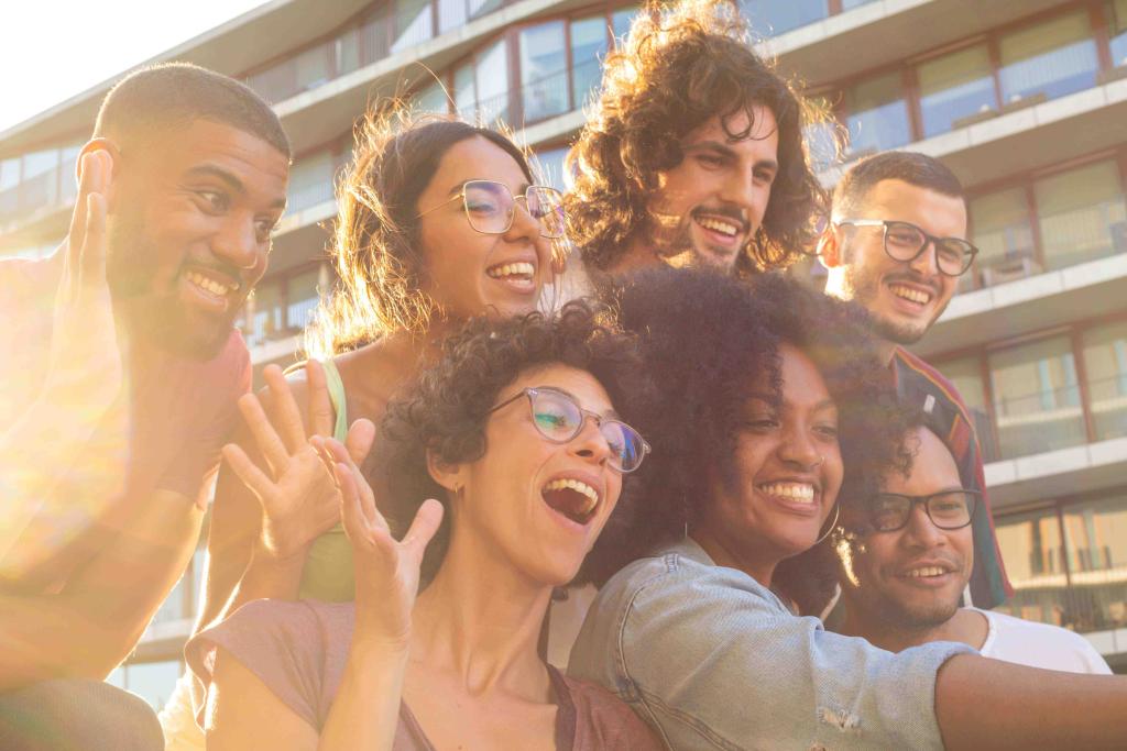 Joyful friends taking a funny group selfie.